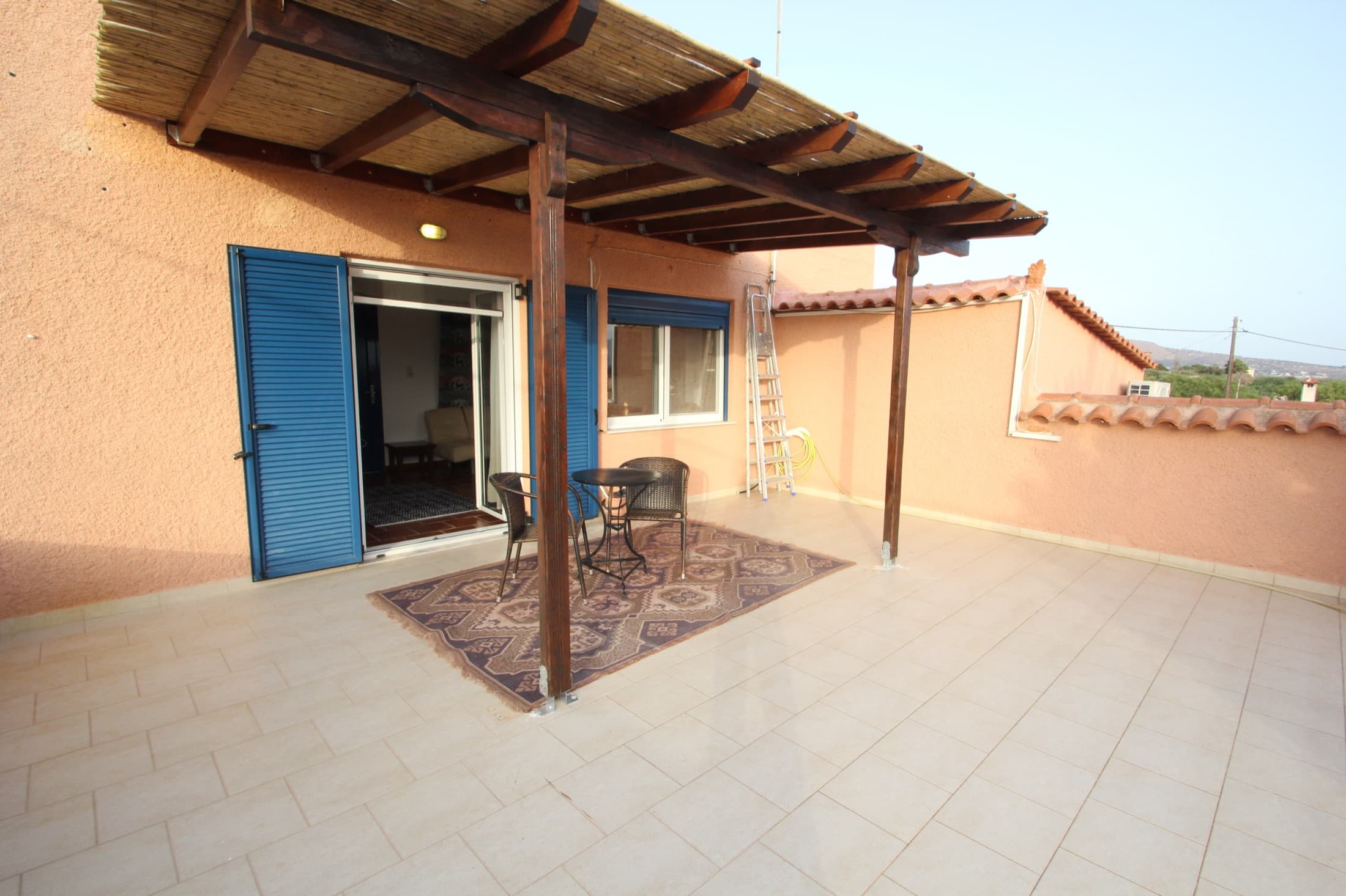 Generous private terrace at Fistiki Studio under a pergola